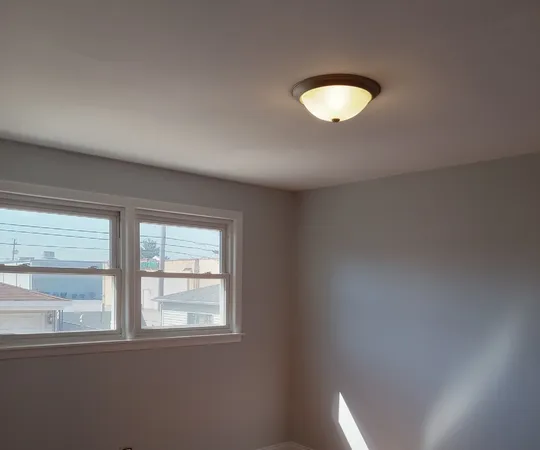 an empty room that has a window