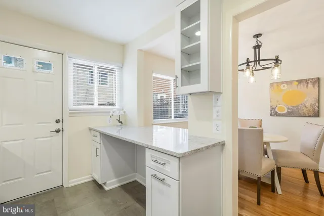 a kitchen with a sink cabinets and window