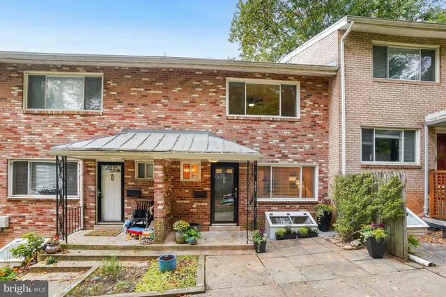a front view of a house with outdoor space