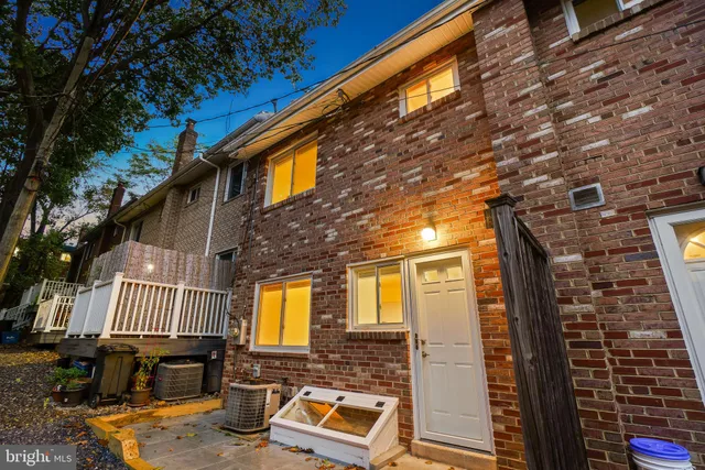 a front view of a house with parking area