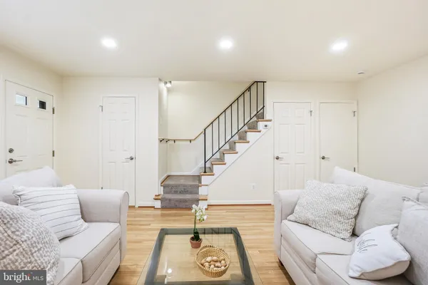 a living room with furniture and a rug