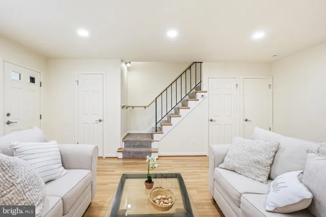 a living room with furniture and a rug