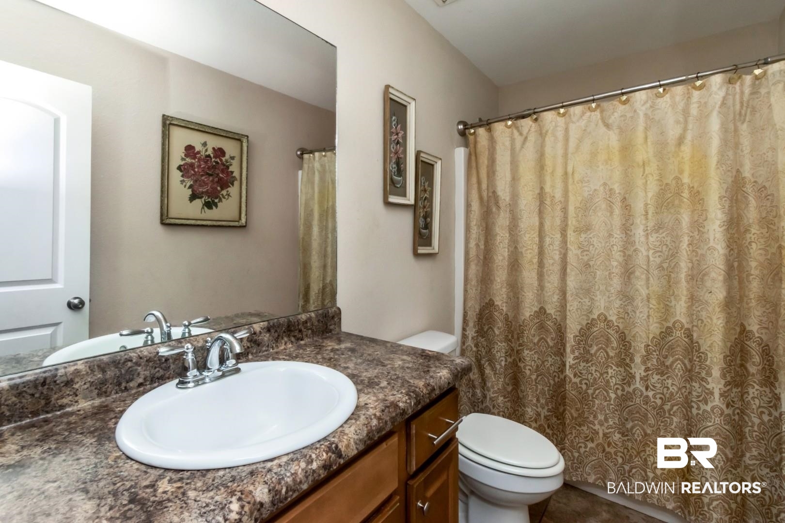 11528 Mocking Bird Lane Fairhope, AL 36532 - Photo 22 of 45 Bathroom featuring vanity and a shower with shower curtain