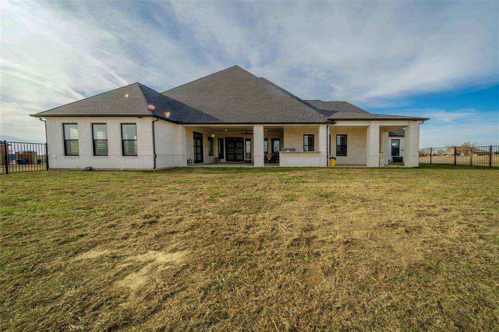 165 Ranch House Road Rockwall, TX 75032 - Photo 37 of 40 a front view of a house with a garden