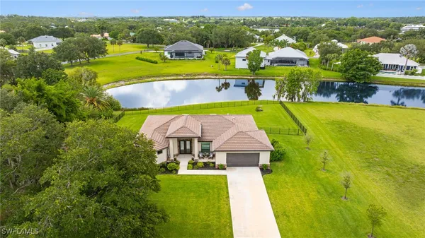 a view of swimming pool with outdoor seating and yard