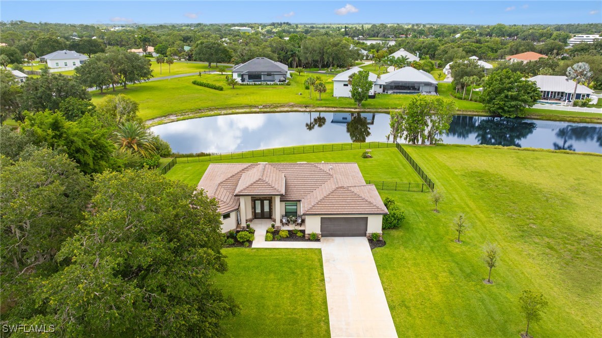 16630 Willow Point Court Alva, FL 33920 - Photo 2 of 46 a view of swimming pool with outdoor seating and yard