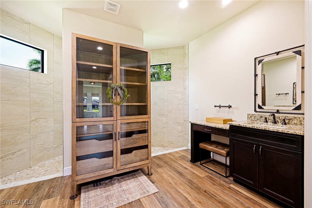 16630 Willow Point Court Alva, FL 33920 - Photo 22 of 46 a room with a dresser and a mirror