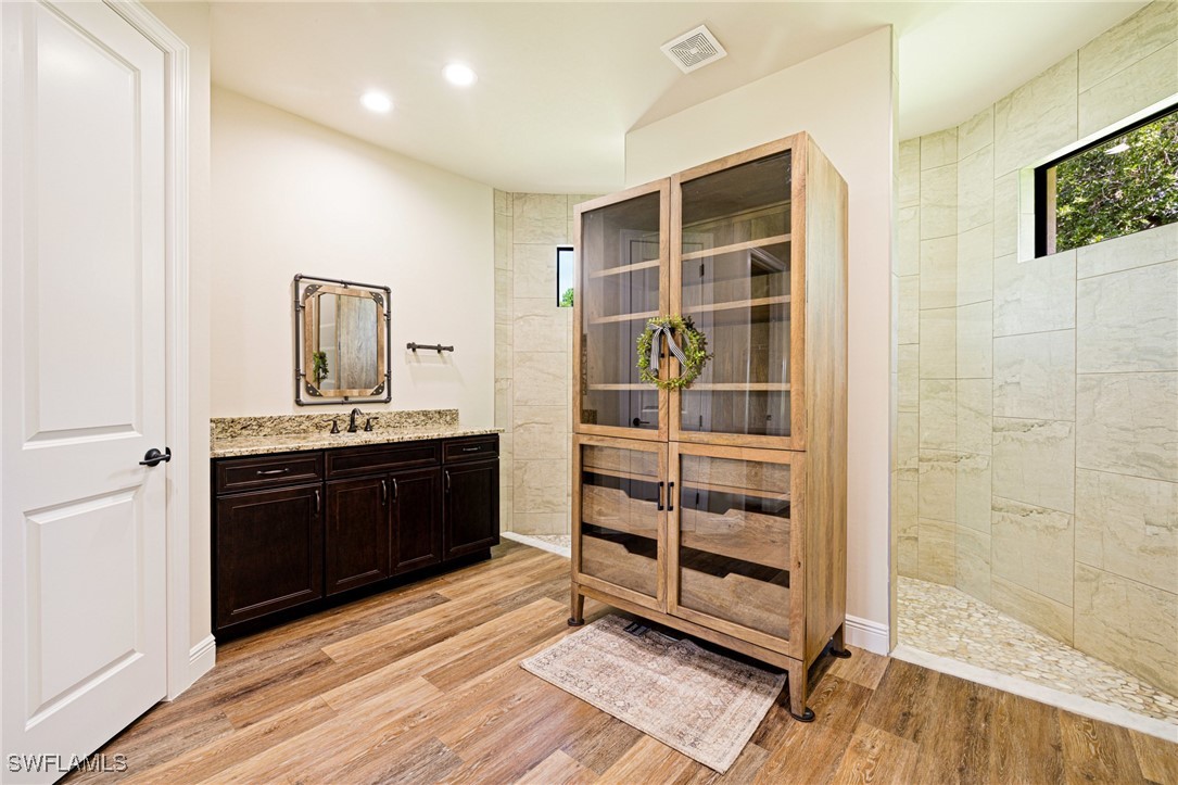 16630 Willow Point Court Alva, FL 33920 - Photo 23 of 46 a room with a dresser and a mirror