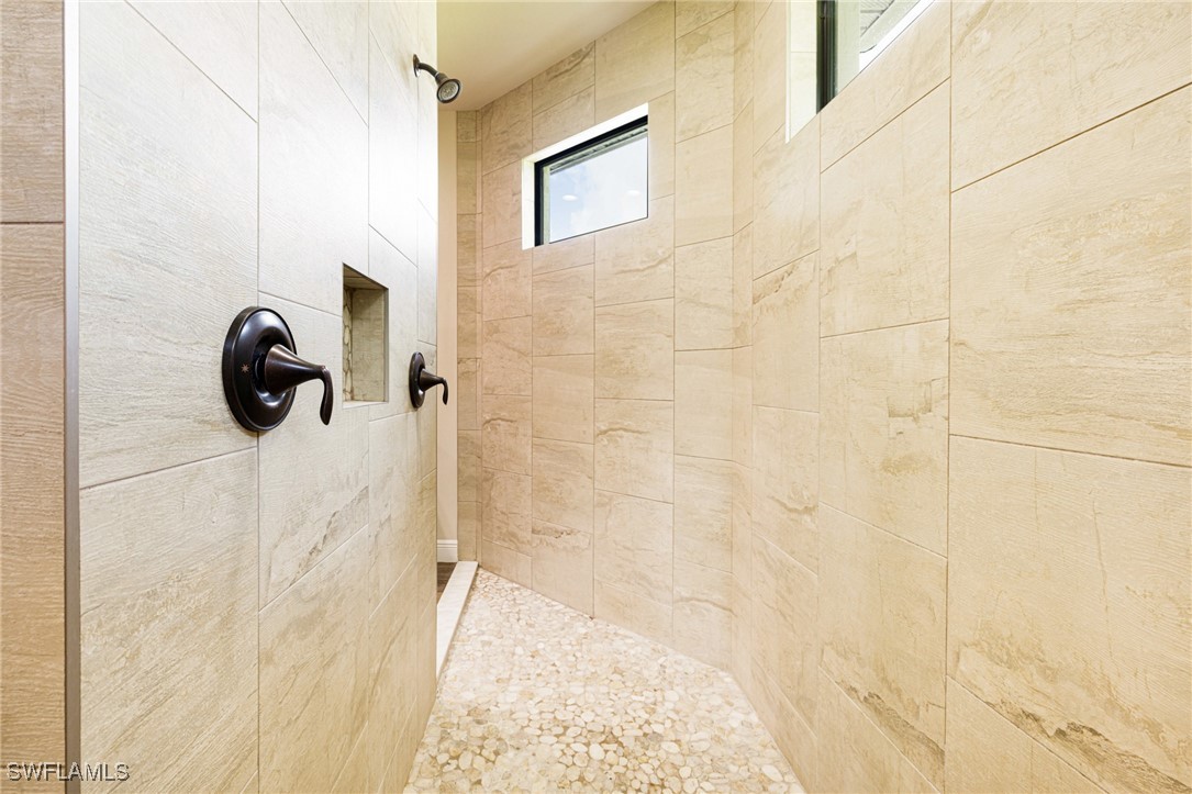 16630 Willow Point Court Alva, FL 33920 - Photo 24 of 46 a bathroom with a shower