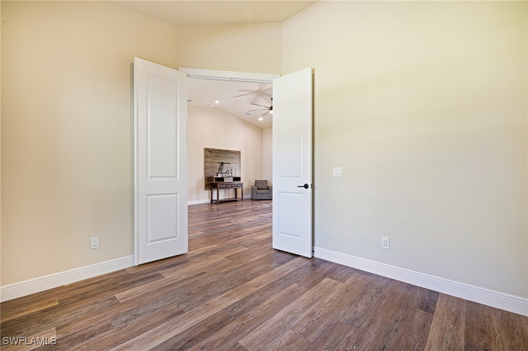 16630 Willow Point Court Alva, FL 33920 - Photo 26 of 46 a big room with wooden floor and a view of bathroom