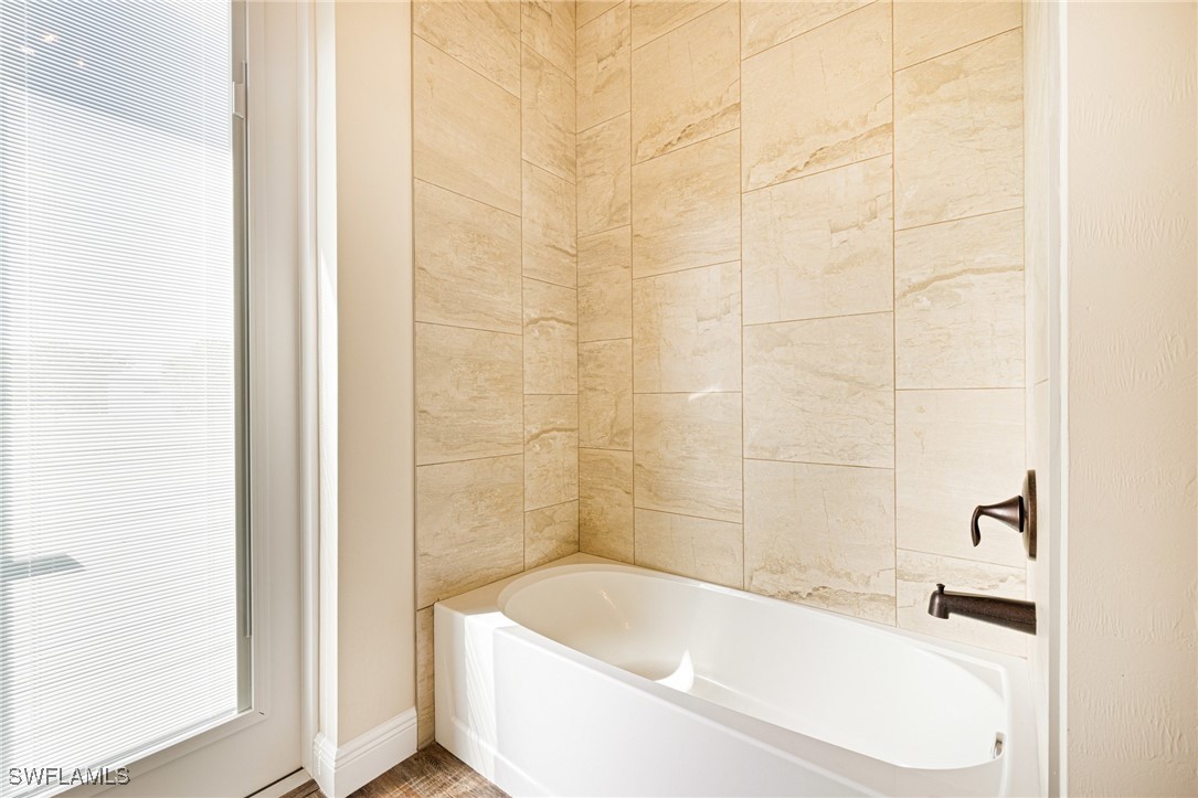 16630 Willow Point Court Alva, FL 33920 - Photo 28 of 46 a bathroom with a bathtub