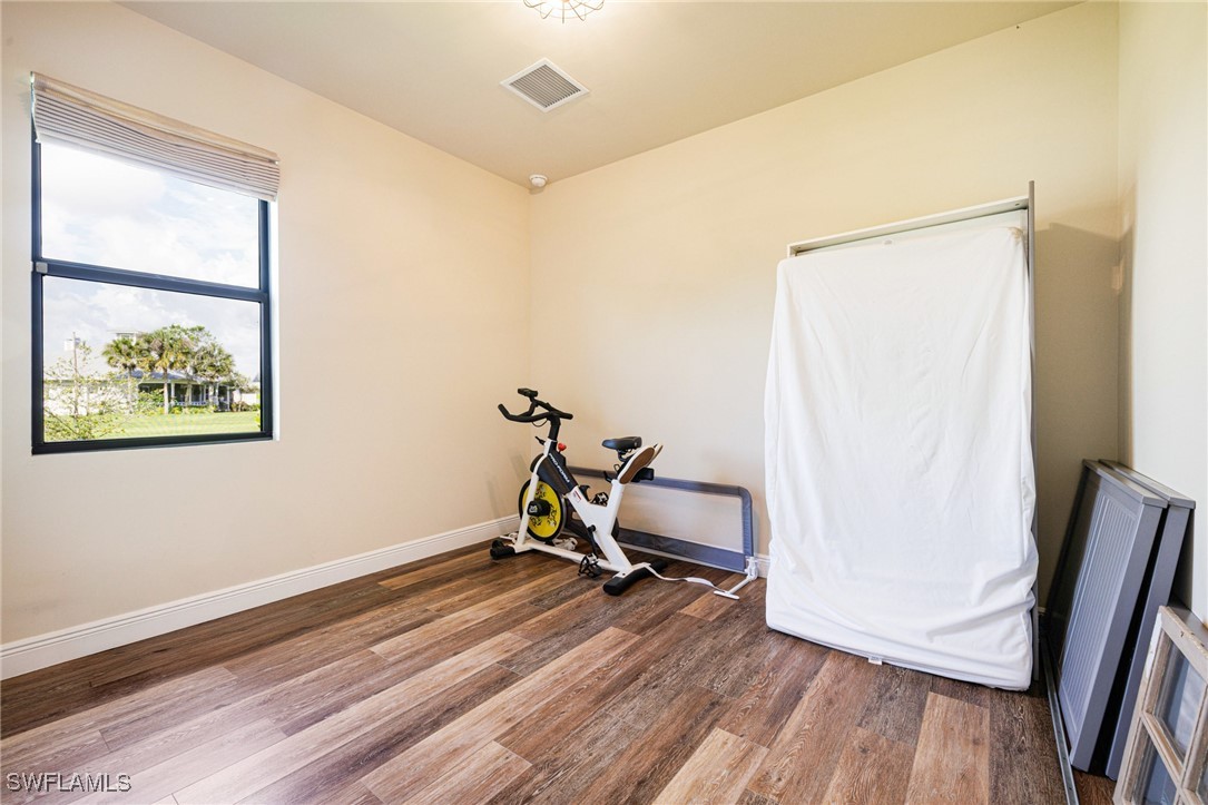 16630 Willow Point Court Alva, FL 33920 - Photo 29 of 46 a view of a room with wooden floor and furniture