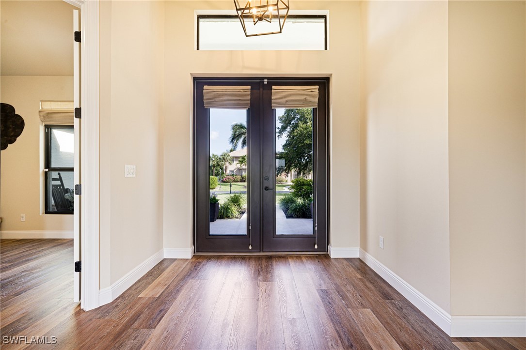 16630 Willow Point Court Alva, FL 33920 - Photo 7 of 46 an empty room with wooden floor and windows