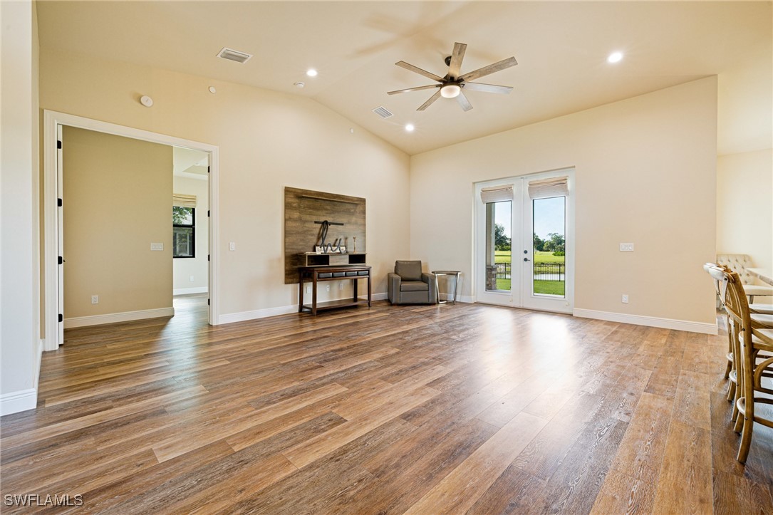 16630 Willow Point Court Alva, FL 33920 - Photo 9 of 46 a view of an empty room with wooden floor and a window