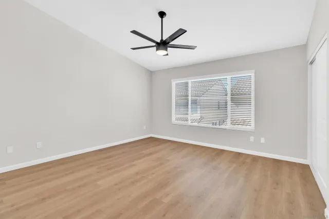 a spacious bathroom with a granite countertop sink mirror and double