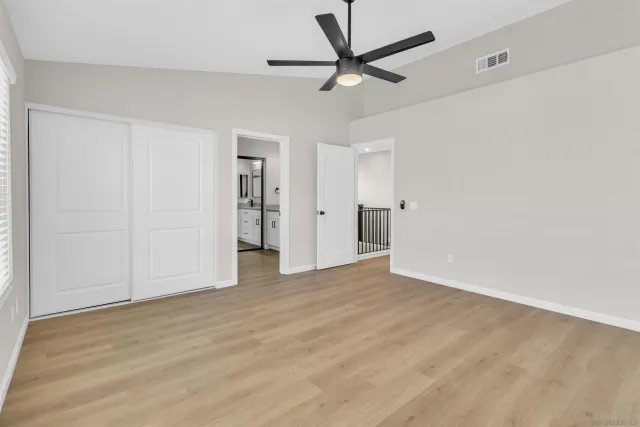a view of hallway with wooden floor