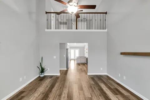 wooden floor in a hall with a window