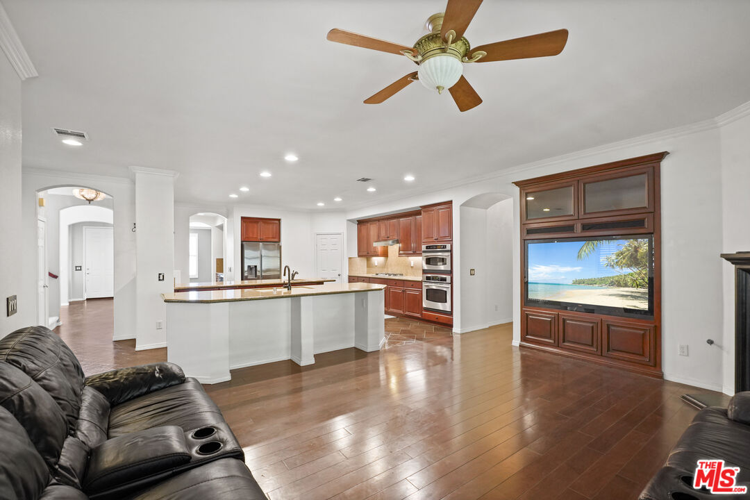 23871 Rio Ranch Way Valencia, CA 91354 - Photo 13 of 46 a living room with stainless steel appliances furniture and a kitchen view