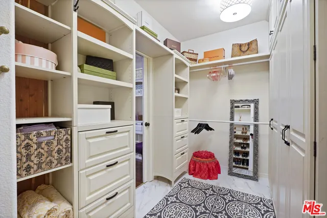a spacious bathroom with a tub sink and mirror