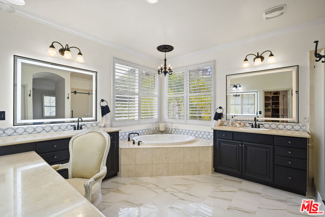 23871 Rio Ranch Way Valencia, CA 91354 - Photo 17 of 46 a spacious bathroom with a tub sink and mirror