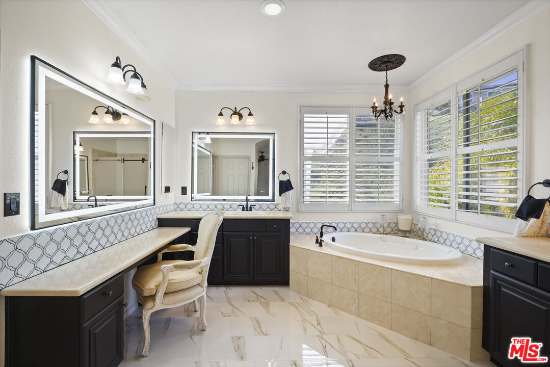 23871 Rio Ranch Way Valencia, CA 91354 - Photo 18 of 46 a spacious bathroom with sinks mirror and a bathtub
