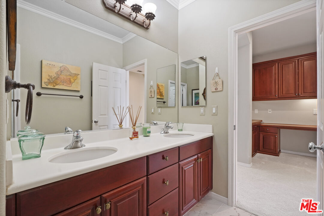 23871 Rio Ranch Way Valencia, CA 91354 - Photo 24 of 46 a bathroom with a double vanity sink mirror and double