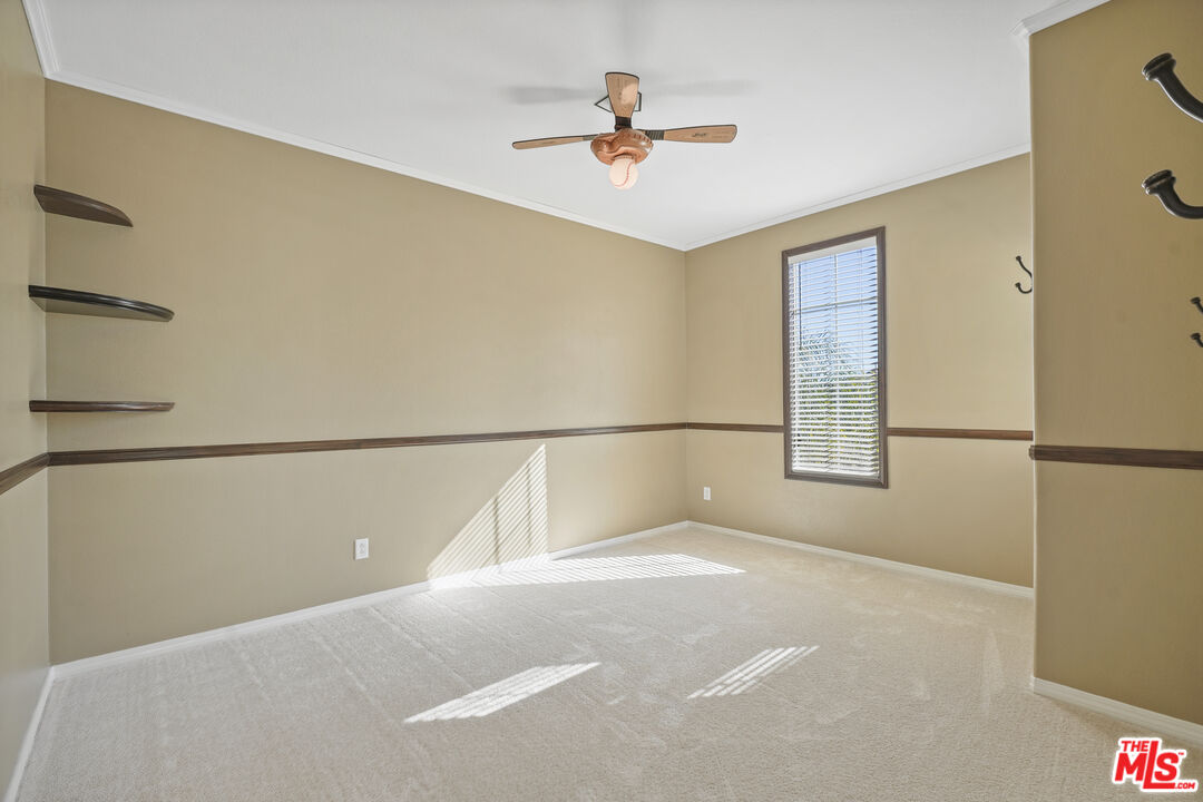 23871 Rio Ranch Way Valencia, CA 91354 - Photo 25 of 46 a view of a livingroom with a ceiling fan