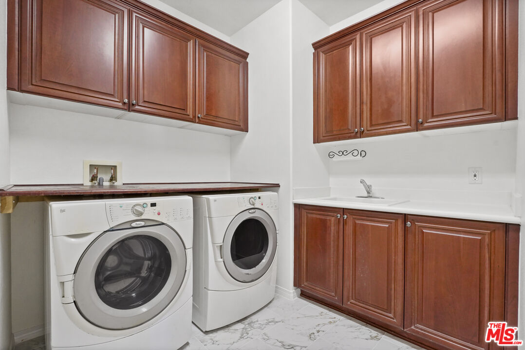 23871 Rio Ranch Way Valencia, CA 91354 - Photo 28 of 46 a utility room with sink dryer and washer