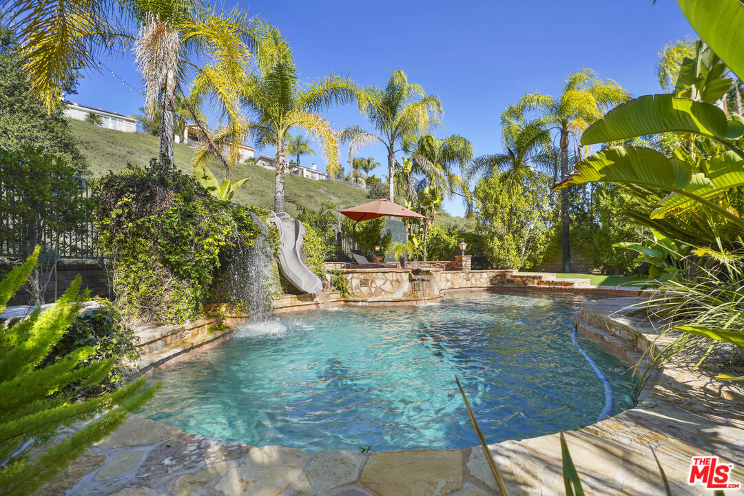 23871 Rio Ranch Way Valencia, CA 91354 - Photo 31 of 46 a view of a yard with swimming pool