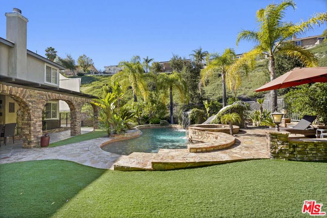 23871 Rio Ranch Way Valencia, CA 91354 - Photo 34 of 46 a view of a garden with a slide