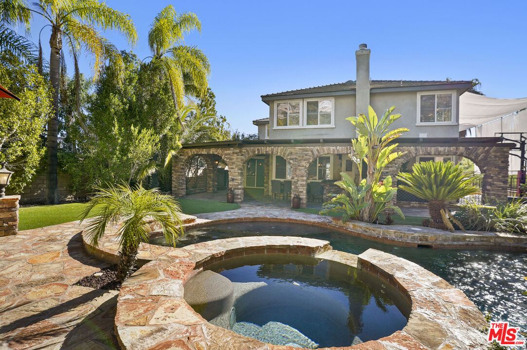 23871 Rio Ranch Way Valencia, CA 91354 - Photo 35 of 46 a view of a house with swimming pool