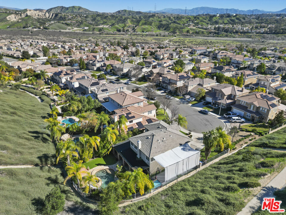 23871 Rio Ranch Way Valencia, CA 91354 - Photo 39 of 46 an aerial view of residential houses with outdoor space and trees