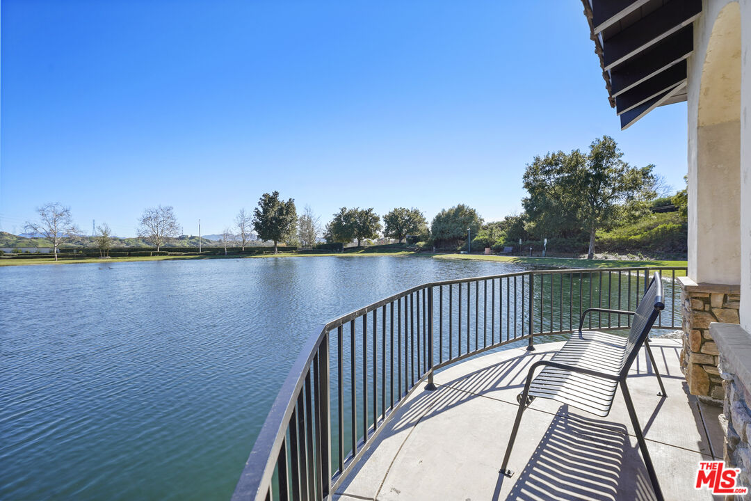 23871 Rio Ranch Way Valencia, CA 91354 - Photo 46 of 46 a view of balcony with wooden floor and lake view