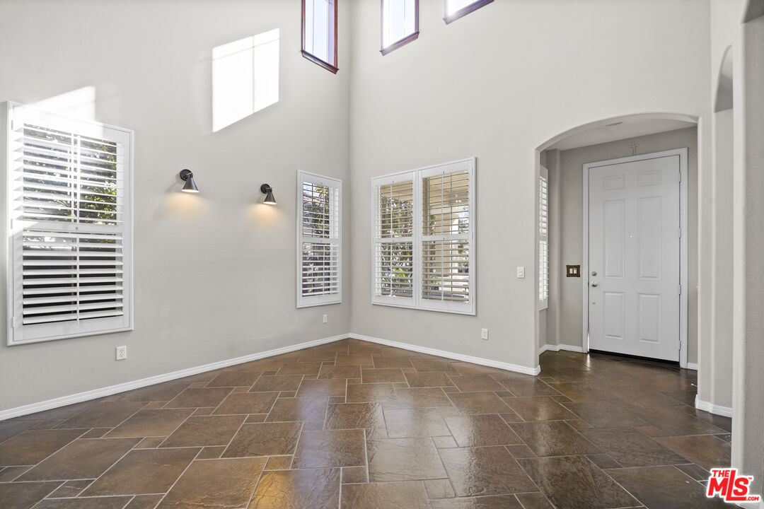 23871 Rio Ranch Way Valencia, CA 91354 - Photo 6 of 46 a view of an empty room with a window