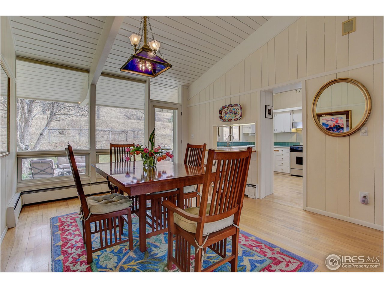 1498 Marshall Road Boulder, CO 80305 - Photo 15 of 40 a dining room with furniture and wooden floor