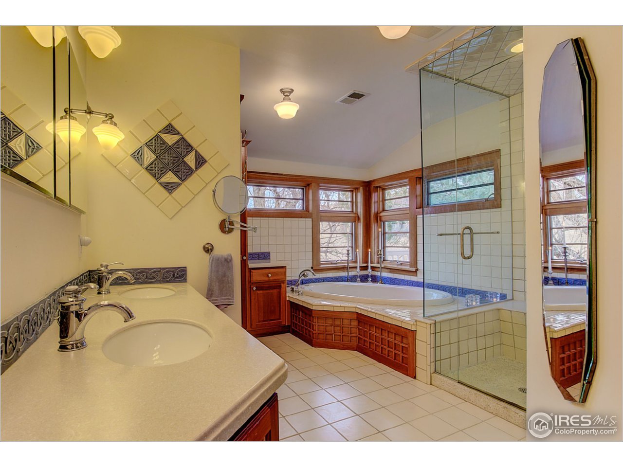 1498 Marshall Road Boulder, CO 80305 - Photo 20 of 40 a bathroom with a tub sink and mirror