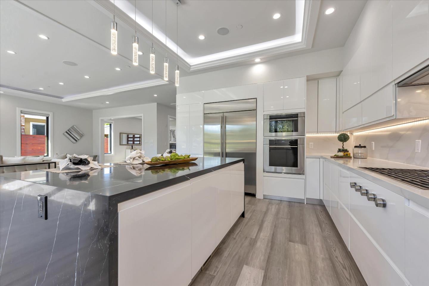 59 Devonshire Avenue Mountain View, CA 94043 - Photo 14 of 53 a large white kitchen with lots of counter top space a sink and stainless steel appliances