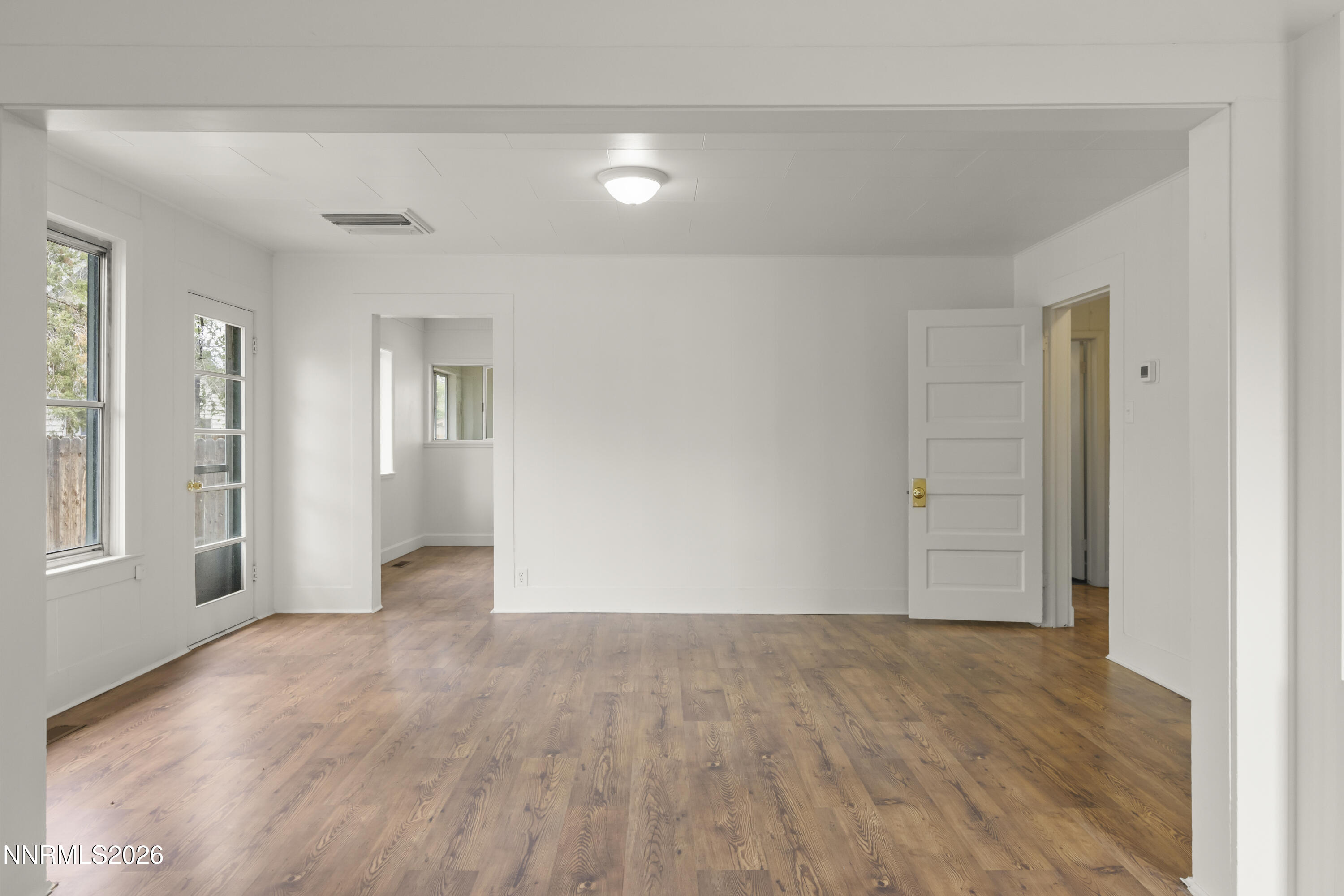 511 Churchill Street Fallon, NV 89406 - Photo 5 of 37 wooden floor in an empty room with a window