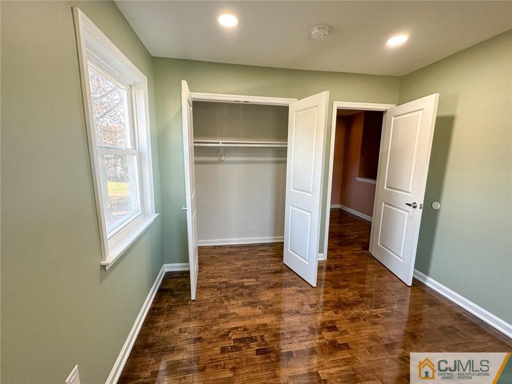 4301 Hana Road Edison, NJ 08817 - Photo 17 of 37 a view of entryway with wooden floor and stairs