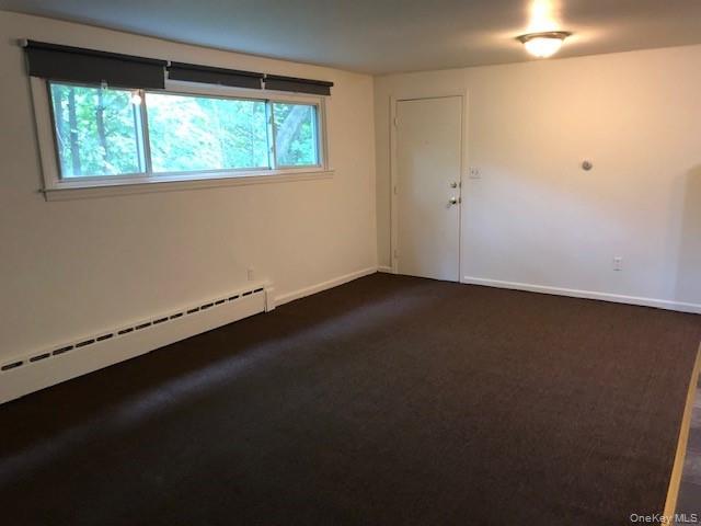 49 Congers Road, Unit 7 New City, NY 10956 - Photo 6 of 11 Spacious living & dining room looking toward the front door