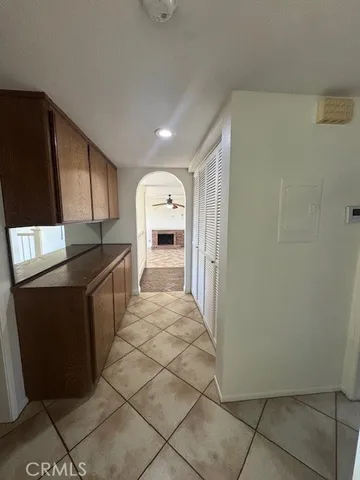a living room with furniture and large windows