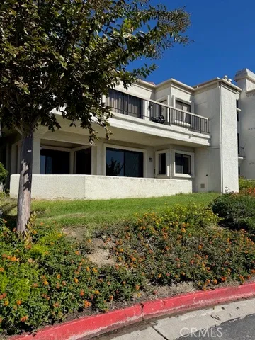 a living room with furniture and large windows