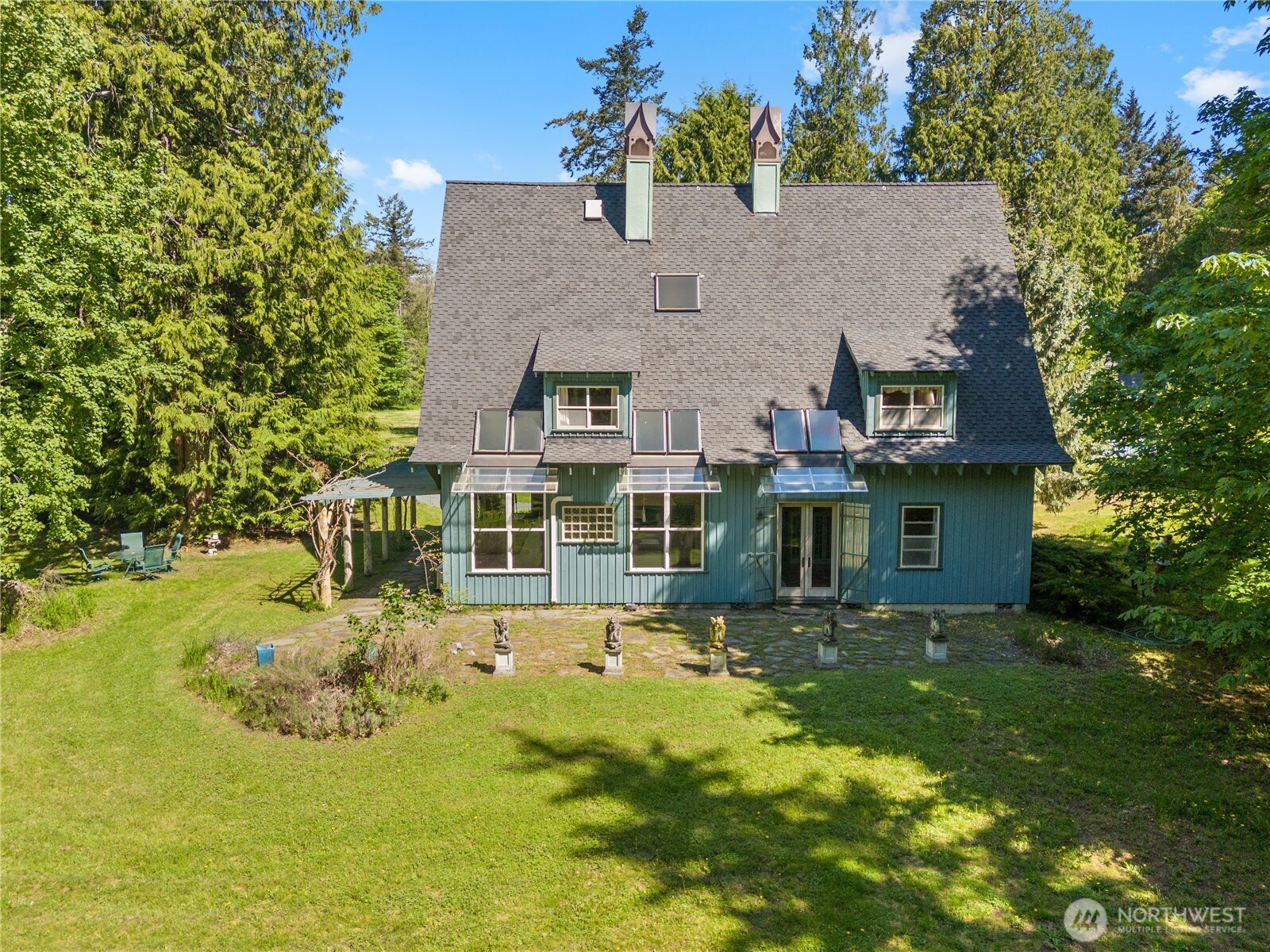5513 Homestead Lane Anacortes, WA 98221 - Photo 1 of 37 an aerial view of a house with a garden