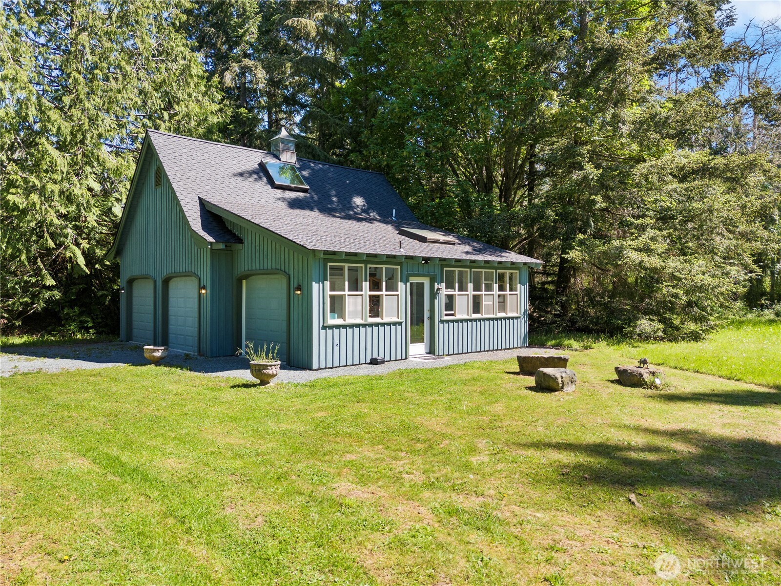5513 Homestead Lane Anacortes, WA 98221 - Photo 2 of 37 a view of a house with swimming pool and a yard