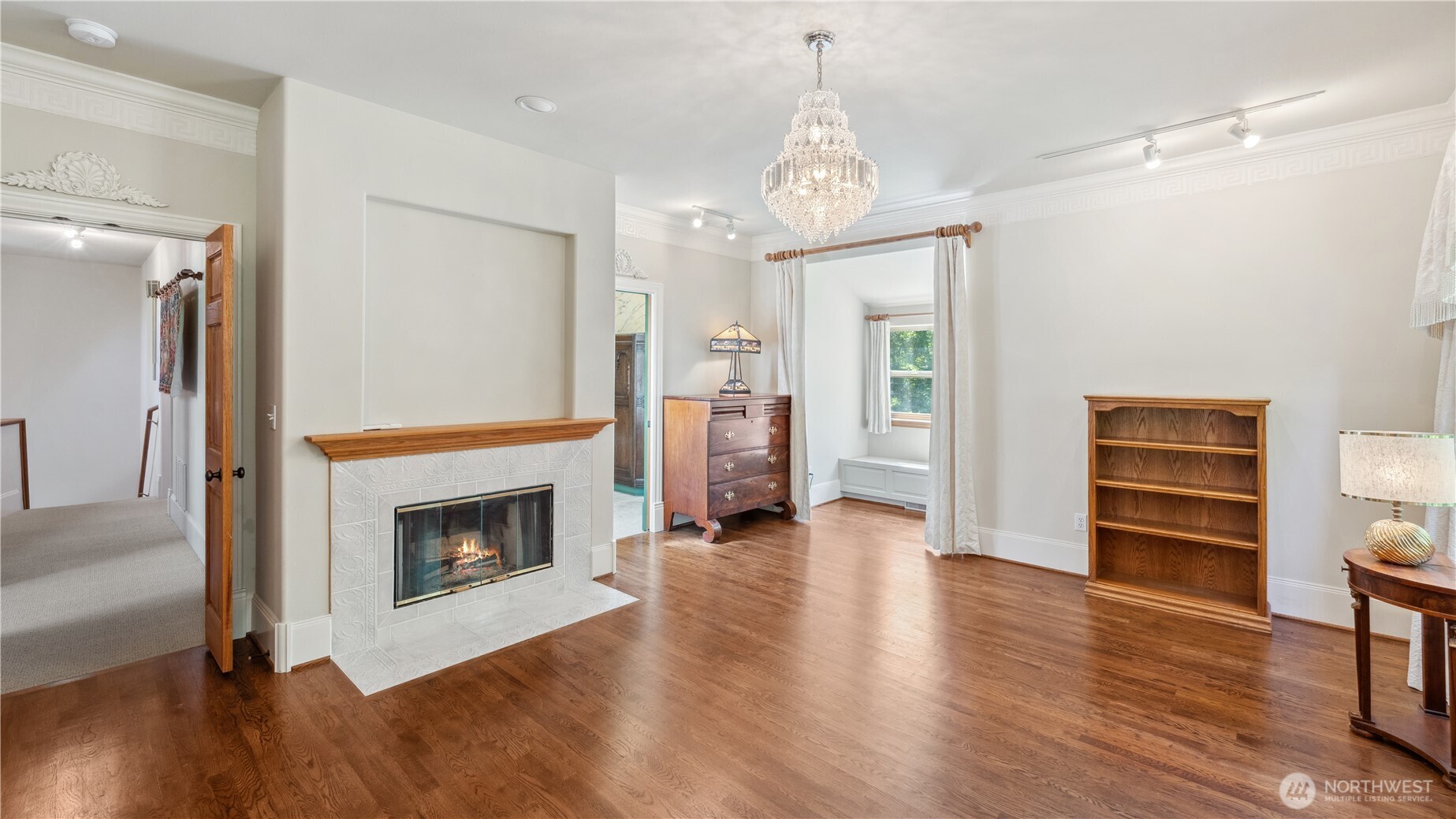 5513 Homestead Lane Anacortes, WA 98221 - Photo 21 of 37 a view of a livingroom with wooden floor and a fireplace