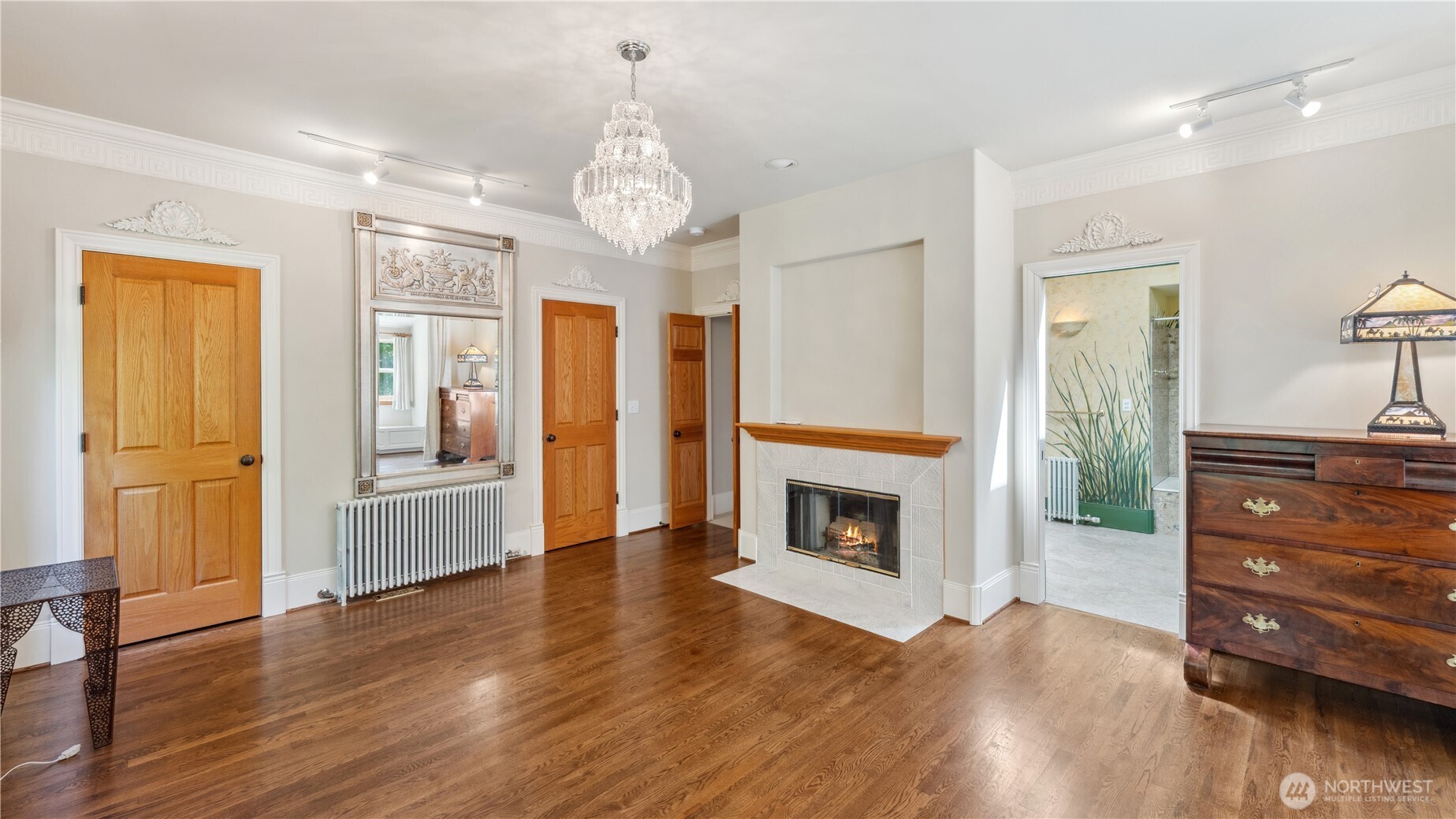 5513 Homestead Lane Anacortes, WA 98221 - Photo 22 of 37 a view of a livingroom with wooden floor and a fireplace