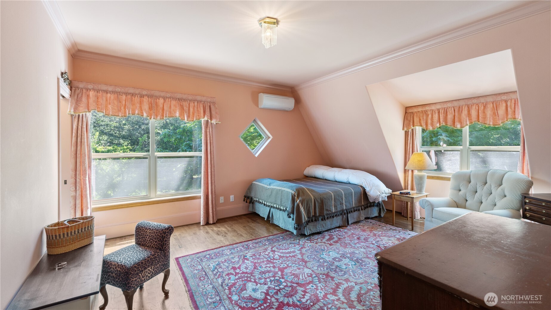 5513 Homestead Lane Anacortes, WA 98221 - Photo 26 of 37 a bedroom with a bed and wooden floor