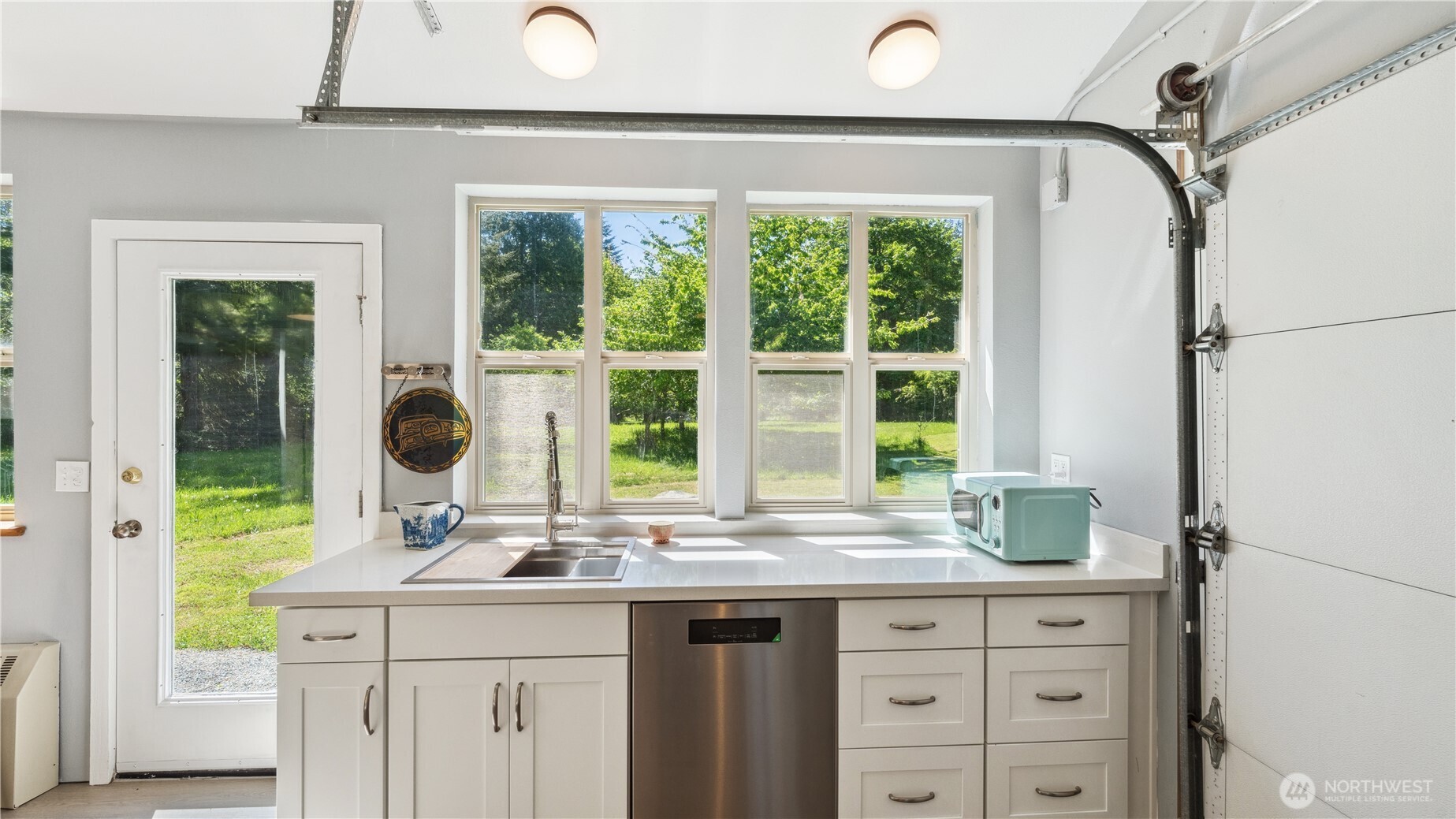 5513 Homestead Lane Anacortes, WA 98221 - Photo 32 of 37 a sink with granite countertop a window