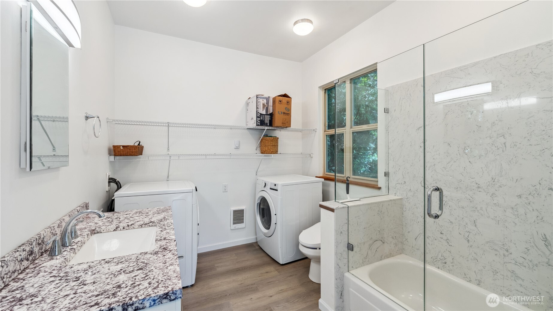 5513 Homestead Lane Anacortes, WA 98221 - Photo 34 of 37 a bathroom with a sink a window and a shower