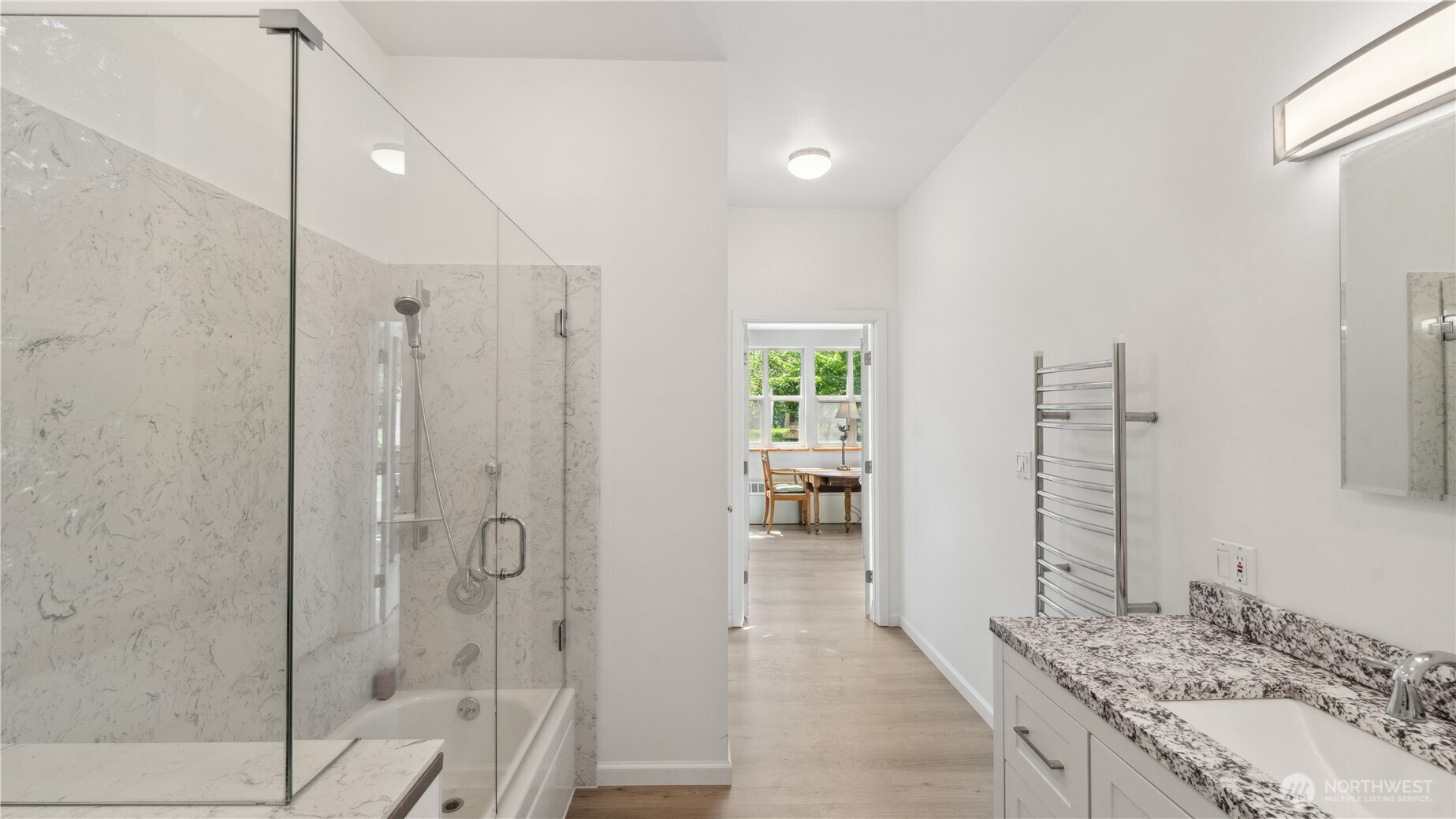 5513 Homestead Lane Anacortes, WA 98221 - Photo 35 of 37 a bathroom with a granite countertop shower a sink and a mirror